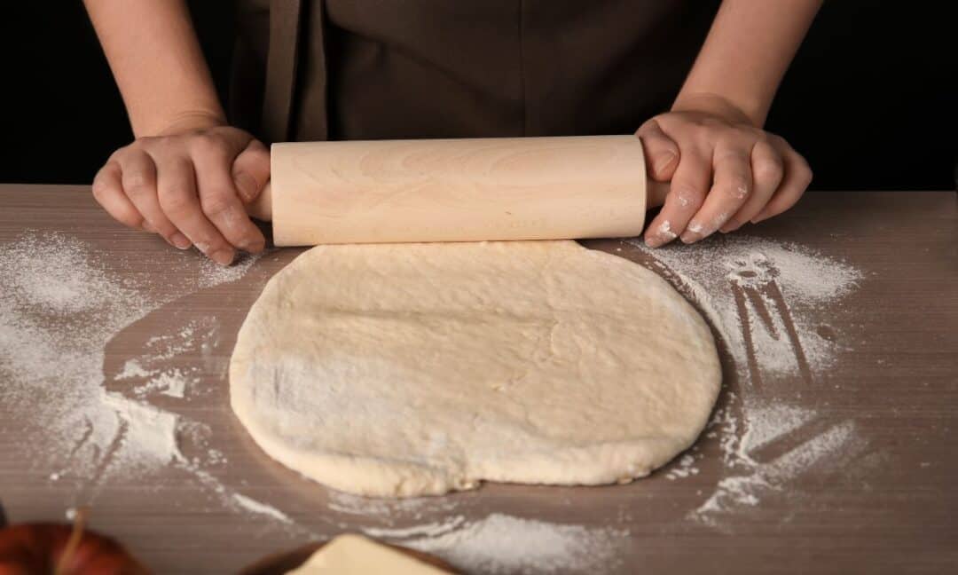 Rolling out the puff pastry sheets